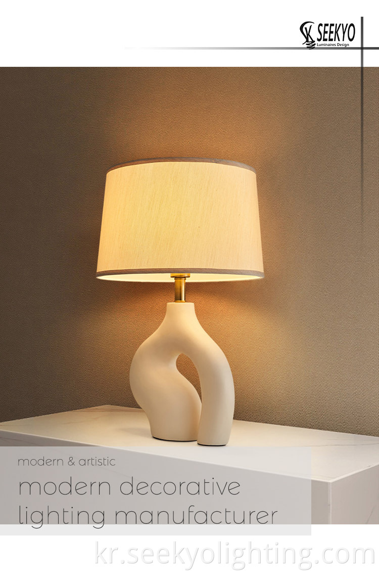 The resin special base fabric shade table lamp is a versatile and timeless lighting option that will enhance the aesthetics of any space.